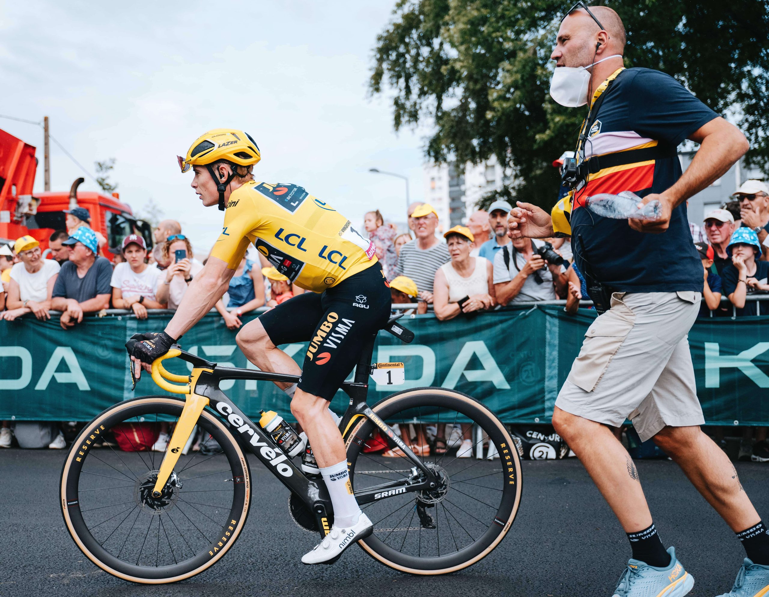 Cyclists and runner