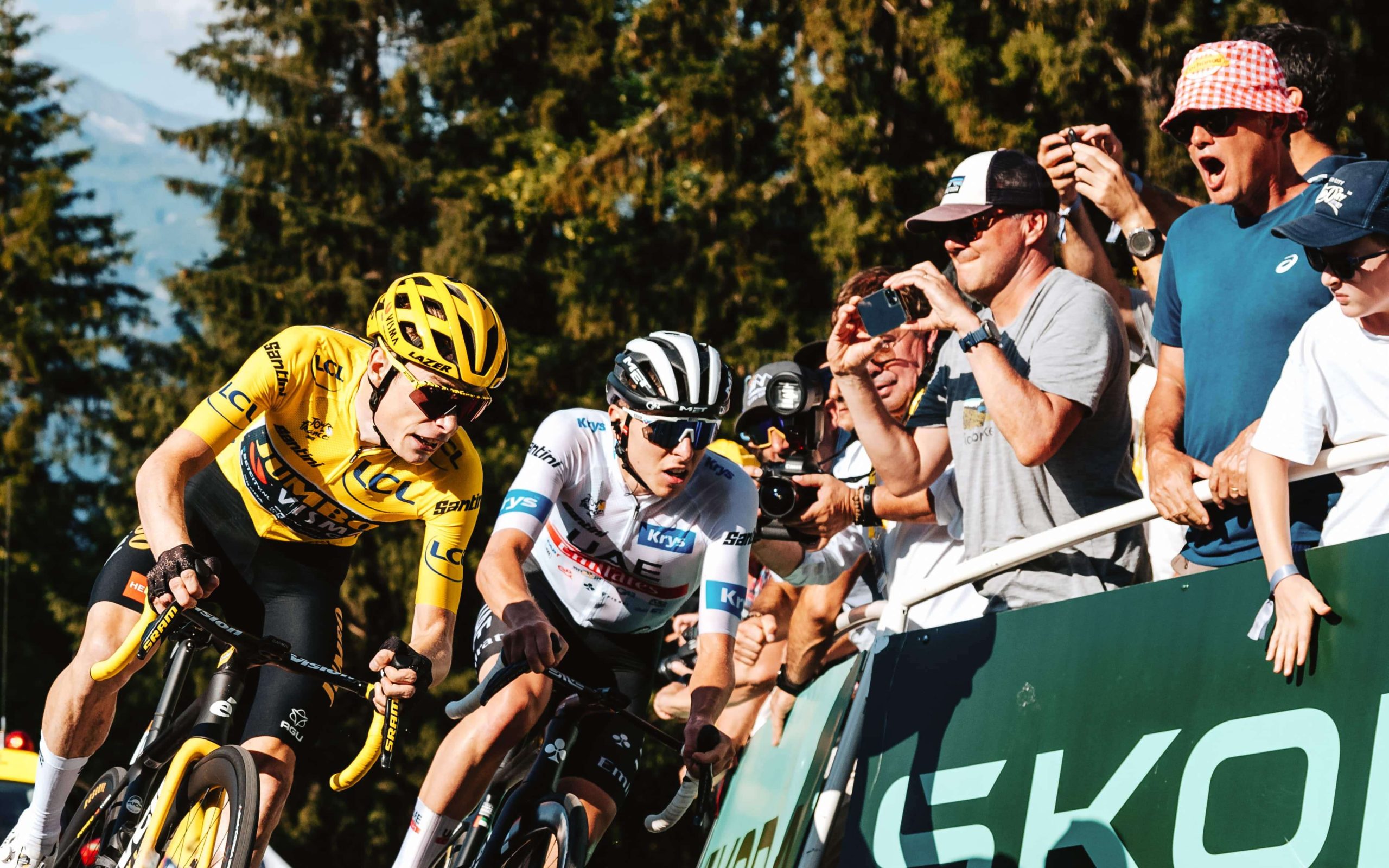 Cyclists with photographers in background